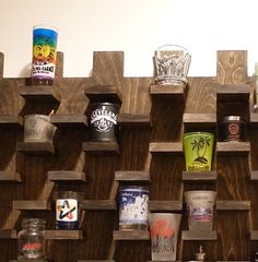 there are many different types of cups on this shelf