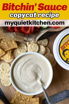 a bowl of dip surrounded by crackers and chips on a cutting board with the words, bitchin'sauce copycat recipe my quieti kitchen