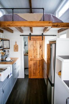 the kitchen is clean and ready to be used as a bedroom in this tiny house