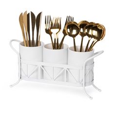 four cups with forks and spoons in them on a white tray against a white background