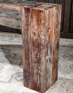 a wooden bench sitting on top of a cement floor