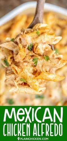 a spoon full of mexican chicken alfredo is being lifted from a casserole dish