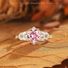 💎 Stone Specifications: 🌟 Main Stone: Pink Sapphire 🌟 Side Stones: Moissanite 🌟 Size of Main Stone: 6.5mm 🌟 Center Stone Carat: 1.5ct 🌟 Cut: Round cut 🔮 Materials Available: ＊ 925 Sterling Silver ＊ 925 Sterling Silver (Electroplated) ＊ 10K Gold ＊ 14K Gold ＊ 18K Gold ＊ Platinum 🎀 Contact us directly to customize your ring size or gemstone - bespoke services available upon request. 🎁 Packaging: Each ring is carefully placed in a beautifully curated gift box, ensuring a luxurious unboxing Dazzling Moissanite Bridal Sets For Gift, Moissanite Bridal Sets As Gift, Exquisite Sapphire Ring With Center Stone As Gift, Rose Gold Sapphire Ring For Wedding, Dazzling Round Bridal Sets, Pink Moissanite Diamond Ring As Gift, Rose Gold Moissanite Cluster Ring As A Gift, Rose Gold Diamond Bridal Sets As Gift, Exquisite 14k Gold Pink Jewelry