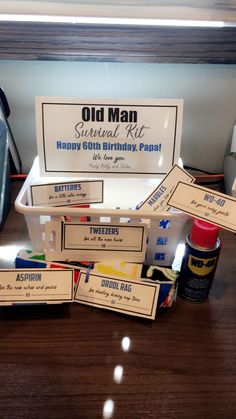 an old man birthday kit is sitting on a desk with other items in the box