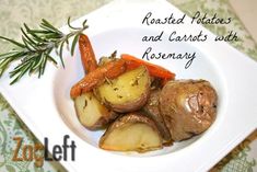 roasted potatoes and carrots with rosemary in a white bowl on a green tablecloth