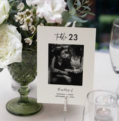 a table with flowers and candles on it