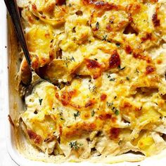 a casserole dish with chicken, cheese and herbs in it is ready to be eaten