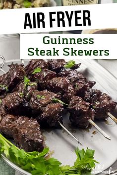 grilled steak skewers with garnishes and parsley on the side