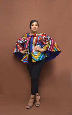 MATILDA Reversible Cape Top(in BLUE & MULTI CLOUR PRINTS) can be styled for all season. You can wear both sides of the Cape. Throw it over your pant/skirt & body hugging top, mini, midi or ankle length dress and you'll be good to go. It is sure a great value for your buck! Material: African wax print, 100% cotton. PRODUCTION: Item is handmade between 5 to 10 business days, SHIPPING (DHL): takes 2 to 5 business days (Note: some locations may take longer than Stated here) PACKAGING: In order to re Tailored Outfits, African Kimono, Ankara Jackets, Ankara Short, Cape Top, Ankara Clothing, Ankara Tops, African Print Tops, African Bride