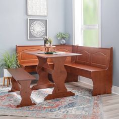 a wooden bench and table in a room