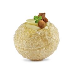 a close up of a ball of bread with nuts and cheese in it on a white background