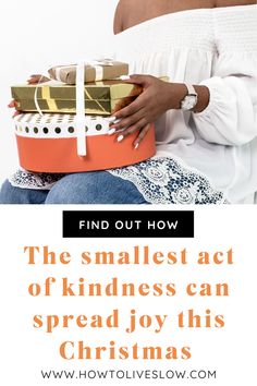 a woman sitting on top of a pile of presents with text overlay reading find out how the smallest act of kindness can spread joy this christmas