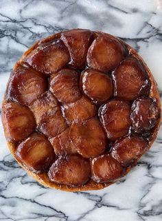 a close up of a pastry on a marble surface