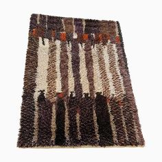 an area rug with different colors and patterns