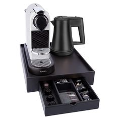 an espresso machine and coffee maker sit on a tray with the drawer open