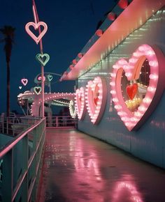 there is a wall with hearts on it and lights in the shape of heart's