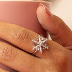 Welcome winter with our whimsical holiday snowflake ring, Crystal. It features 100% simulated diamond material (AAA CZ) stones on each of the 6 arms, adding sparkle to your whole look. It is about 3/4" in size. The intricate design of the certified 925 sterling silver band is plated in rhodium. Buy this intricate ring design for the holidays and enjoy a festive and fun look, that can carry on throughout the winter season! Snowflake Rings, Intricate Ring, Intricate Rings, Welcome Winter, Holiday Snowflakes, Hammered Silver Ring, Ring Crystal, Hammered Rings