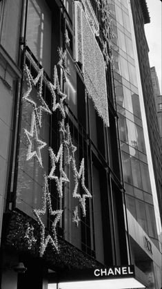 the chanel store in new york city's times square is decorated with christmas lights