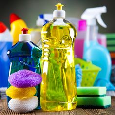 several cleaning products on a wooden table with the words wap written below it in yellow