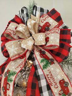 a christmas tree with a red and black bow