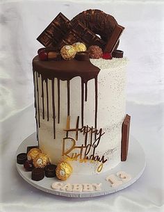 a birthday cake decorated with chocolates and candies