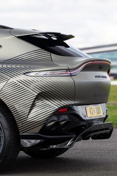 the rear end of a silver sports car