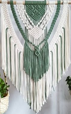 macrame wall hanging with green and white colors