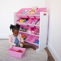 This 34'' multi-bin toy organizer keeps your child's favorite toys on hand and in place. Crafted from engineered wood and plastic, this toy organizer features two solid supports with sled bases that hold up 12 open-top bins, each sliding into place for a cozy, clean fit. Two sizes of bins - one larger and one smaller - make sure that there's plenty of space for everything from toy cars and building blocks to craft supplies and stuffed animals. Plus, its neutral white hue pairs easily with bright Kids Toy Organizer, Toy Bin Organizer, Toy Storage Organizer, Kids Toy Organization, Toy Organizer, Nursery Toys, Toy Storage Boxes, Plastic Bins, Toy Cars