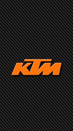 an orange ktm logo on a black carbon fiber textured background with the letter ktm