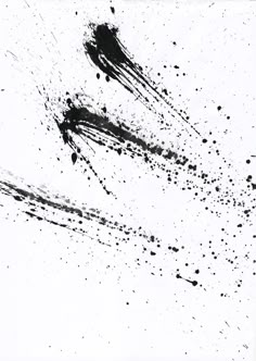 black ink splattered on white paper