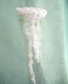 a white jellyfish hanging from the ceiling