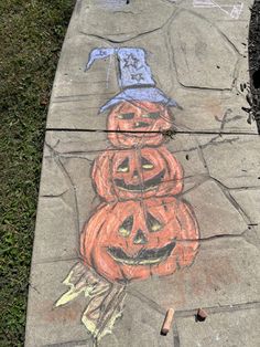 the sidewalk has been decorated with pumpkins and is painted to look like jack - o'- lanterns