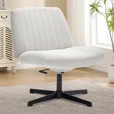 a white office chair sitting on top of a rug