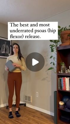 a woman standing in front of a book shelf holding a piece of paper with the caption, the best and most underrated psoas hip flexop release release release