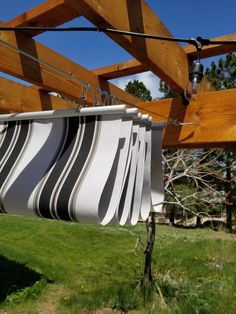 a striped fabric hanging from a wooden structure