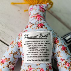 the back of a stuffed animal with a label on it's chest that says, damnmet doll