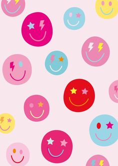 many different colored smiley faces on a pink background