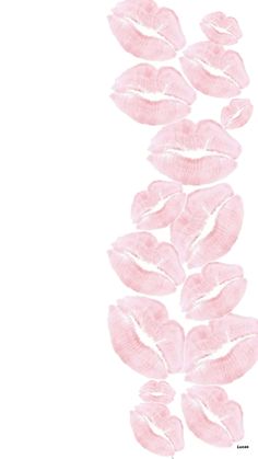 pink lipstick smudges are arranged in the shape of a flower on a white background