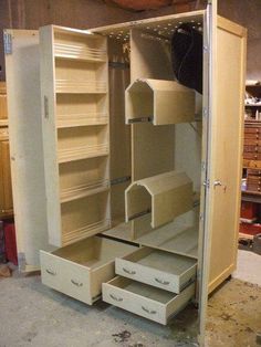 an open closet with drawers and shelves in it