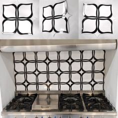 a stove top oven sitting inside of a kitchen next to a wall with decorative tiles on it