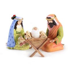 three nativity figurines sitting next to each other