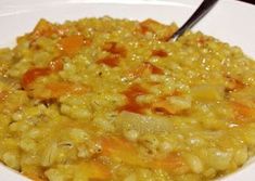 a white plate topped with rice and carrots