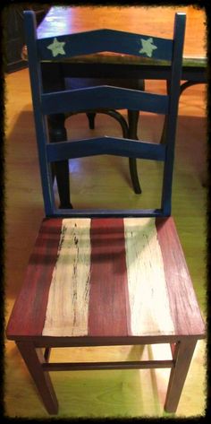 a wooden chair with an american flag painted on it