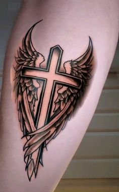 a cross with wings on the thigh