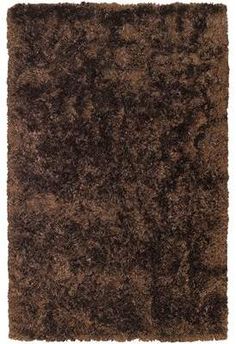 an area rug with brown shaggy on the bottom and dark brown shag in the middle