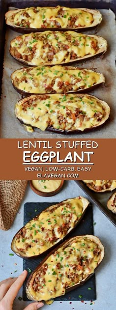 baked stuffed eggplant with meat and cheese on a baking sheet