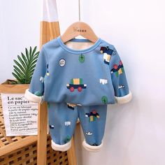 2-piece Cartoon Design Pajamas Sets for Children Boy - PrettyKid Winter Cotton Blue Sets, Blue Cotton Winter Sets, Cotton Sets For Bedtime In Winter, Winter Cotton Bedtime Sets, Cotton Winter Bedtime Sets, Cotton Bedtime Sets For Winter, Winter Loungewear Sets, Blue Long Sleeve Sleepwear For Fall, Casual Cartoon Print Sleepwear For Winter