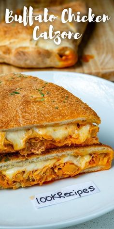 a grilled chicken and cheese sandwich on a plate with the words buffalo chicken, calzonee