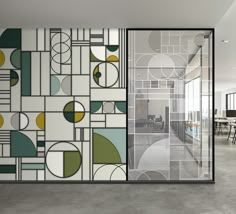 an empty room with glass doors and geometric designs on the wall, along with a chair