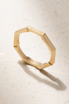 Gucci's 'Link to Love' ring is perfect for stacking alongside other styles in the collection. Made in Italy from 18-karat gold, it has a slim octagonal band that mimics a mechanical bolt and is engraved with the brand's moniker on one edge. Classic Gucci Bangle Bracelets, Classic Gucci Bangle Jewelry, Classic Gucci Bangle, Modern Gucci Yellow Gold Jewelry, Modern Gucci Rings For Anniversary, Gucci Fine Jewelry Yellow Gold Rings, Gucci Yellow Gold Fine Jewelry Rings, Elegant Gucci Rings For Wedding, Elegant Gucci Wedding Rings